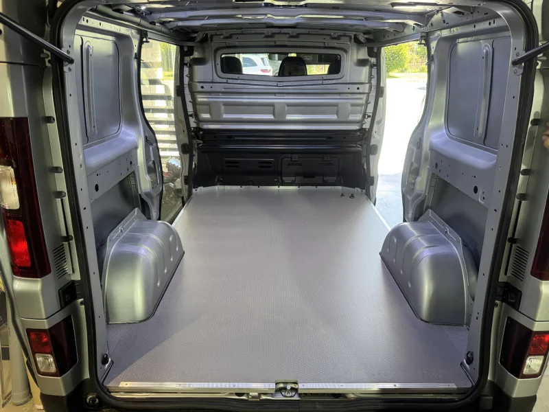 Cargo area fit-out for motorcycle transport